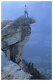 man on ledge at Glacier Point